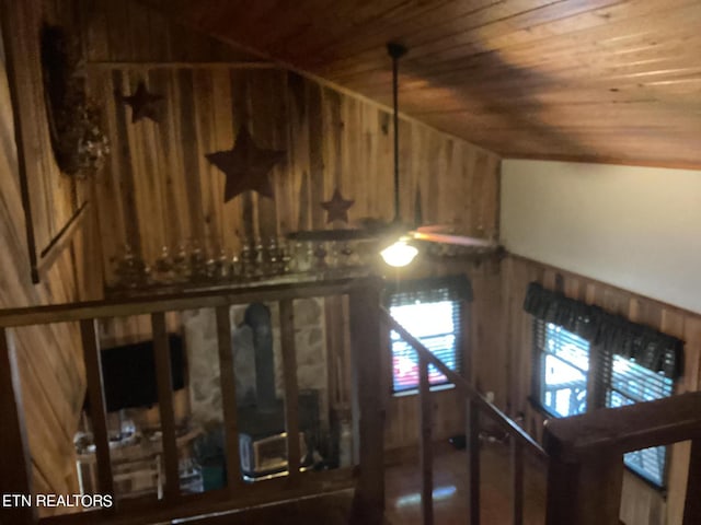 details with ceiling fan, wooden walls, and wooden ceiling