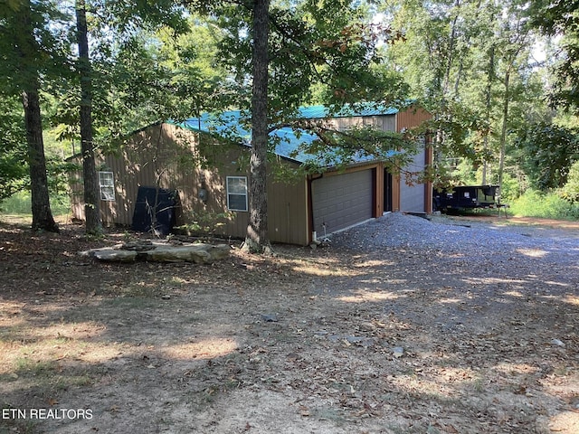 exterior space featuring gravel driveway
