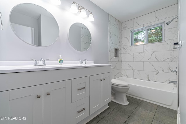 full bathroom with tiled shower / bath, vanity, tile patterned flooring, and toilet