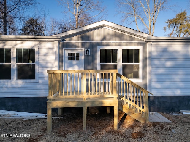 back of house featuring a wooden deck