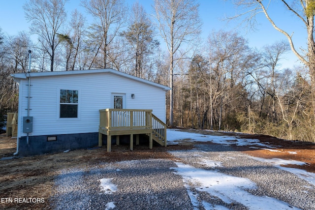 view of snow covered house