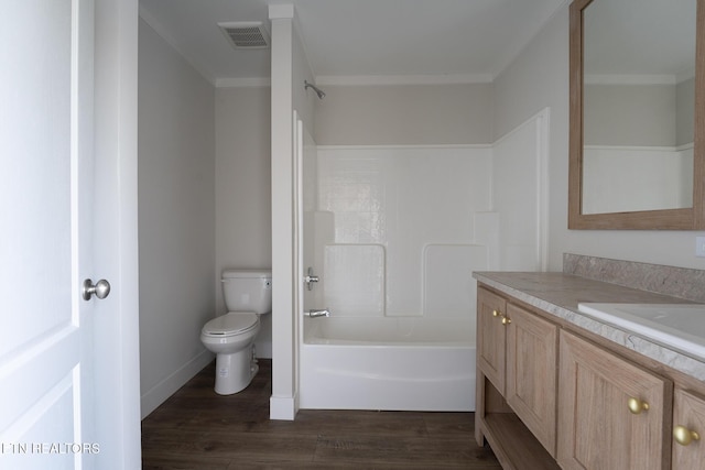 full bathroom featuring shower / bathtub combination, hardwood / wood-style flooring, toilet, and vanity