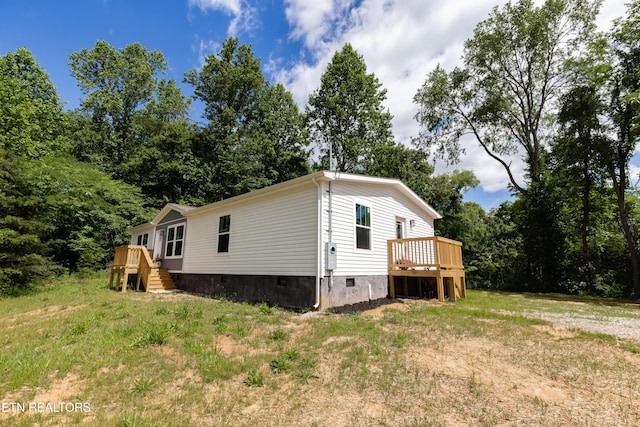 105 Highland Ave, Clinton, TN 37716 - view of side of home featuring crawl space and a deck