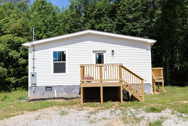 105 Highland Ave, Clinton, TN 37716 - rear view of house with a wooden deck and crawl space