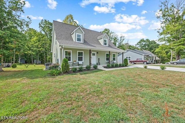 cape cod house with a porch and a front yard