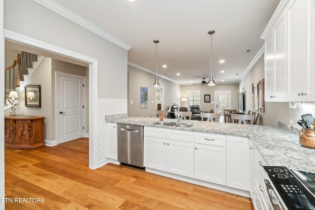 kitchen featuring light wood-type flooring, dishwasher, white cabinets, and sink