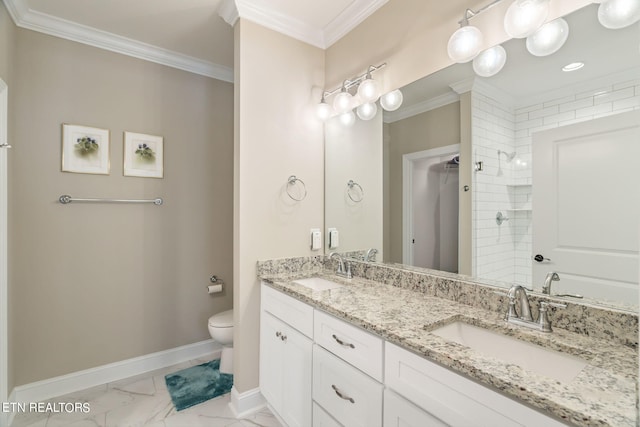 bathroom featuring a tile shower, vanity, toilet, and ornamental molding