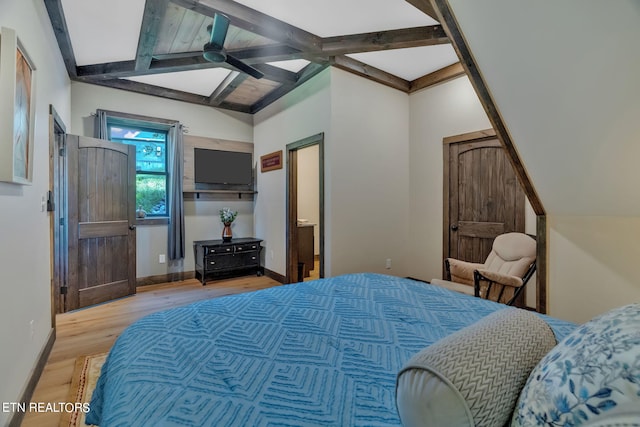 bedroom with ceiling fan, beam ceiling, and light hardwood / wood-style flooring