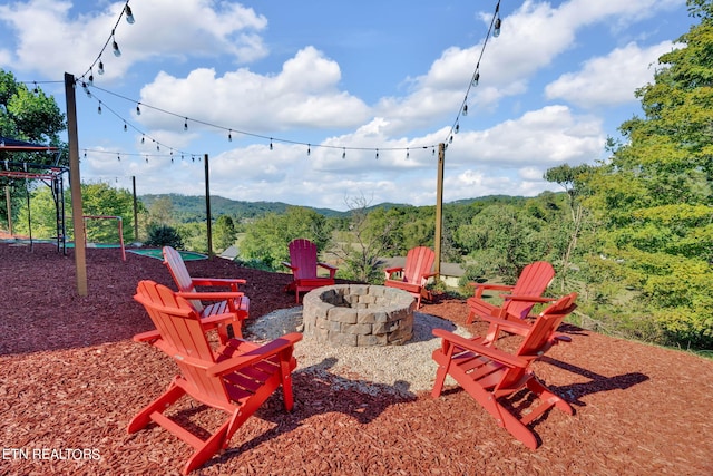 view of patio / terrace with an outdoor fire pit