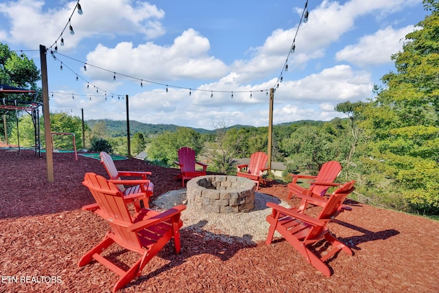 view of patio / terrace featuring an outdoor fire pit