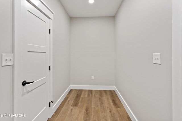 corridor featuring light hardwood / wood-style floors