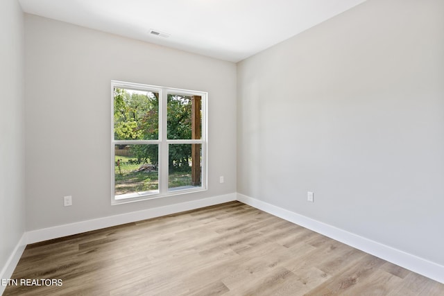 empty room with light wood-type flooring