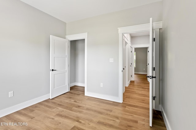 unfurnished bedroom featuring light wood-type flooring