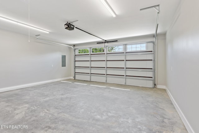 garage featuring a garage door opener and electric panel