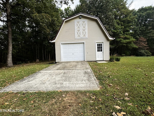 garage featuring a lawn