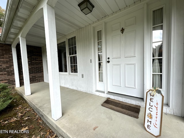 doorway to property with a porch