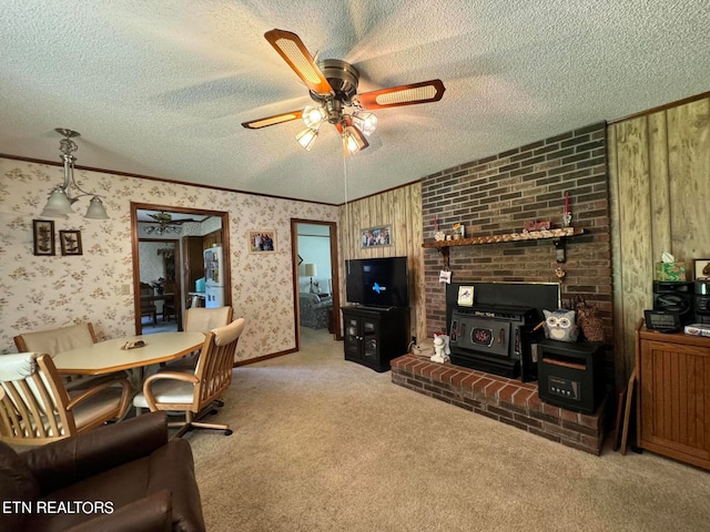 living room with ceiling fan and a textured ceiling