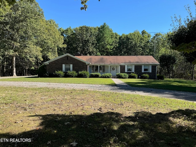 ranch-style home with a front yard