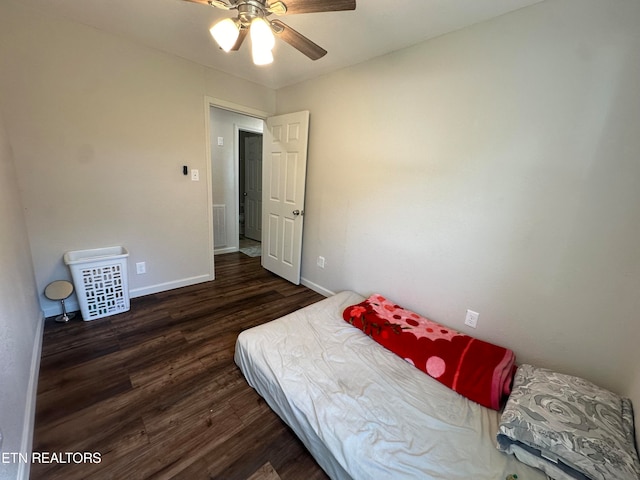 bedroom featuring ceiling fan and dark hardwood / wood-style flooring