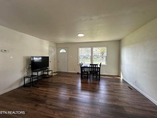 living room featuring dark wood-type flooring