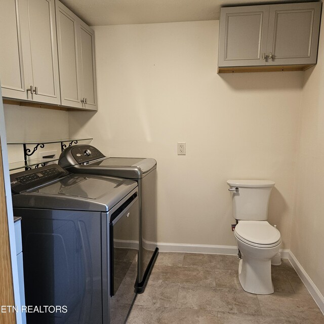 clothes washing area featuring washing machine and clothes dryer