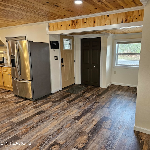 kitchen featuring wood ceiling, dark hardwood / wood-style flooring, light brown cabinets, crown molding, and stainless steel fridge with ice dispenser