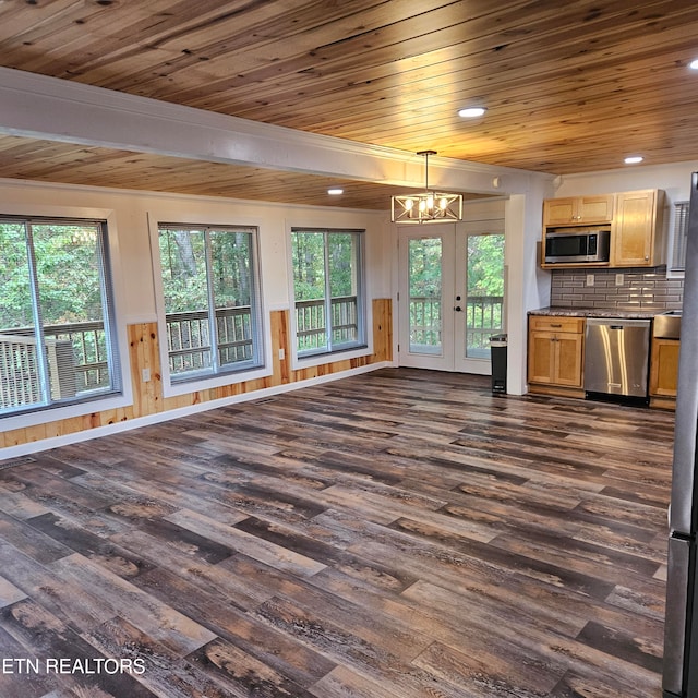 unfurnished living room featuring wooden ceiling, a chandelier, and dark hardwood / wood-style floors