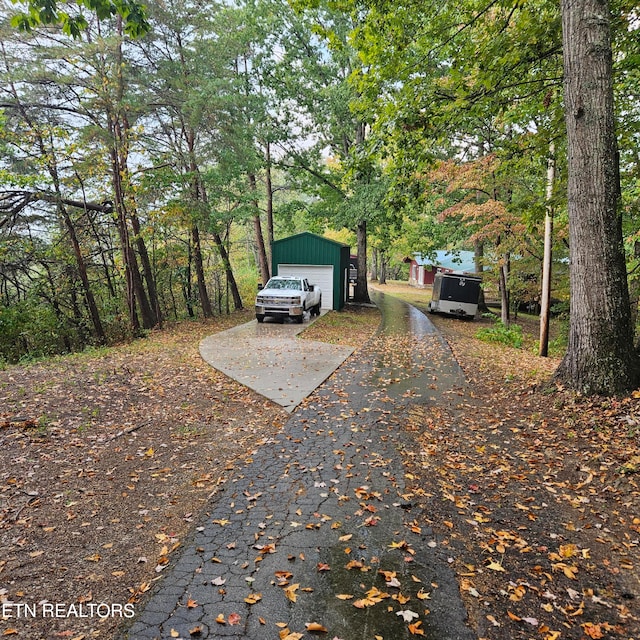 view of front of home featuring an outdoor structure and a garage