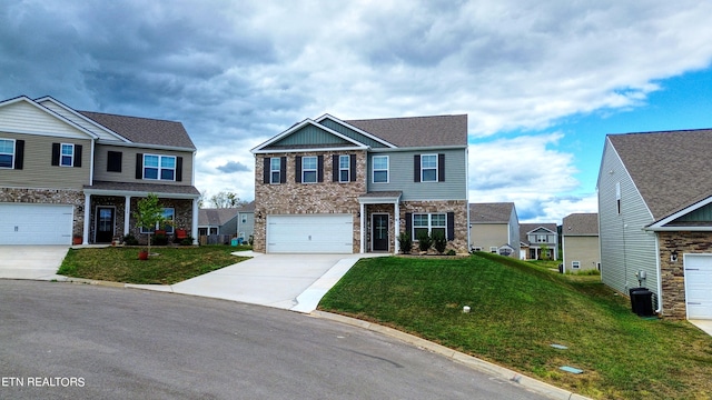 view of front of home with a front yard and a garage