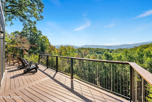 wooden terrace featuring a mountain view