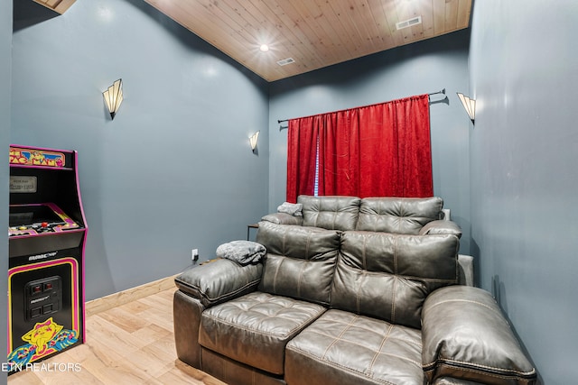 home theater featuring wood ceiling, wood-type flooring, and lofted ceiling