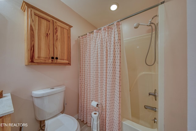 full bathroom with shower / tub combo with curtain, vanity, and toilet