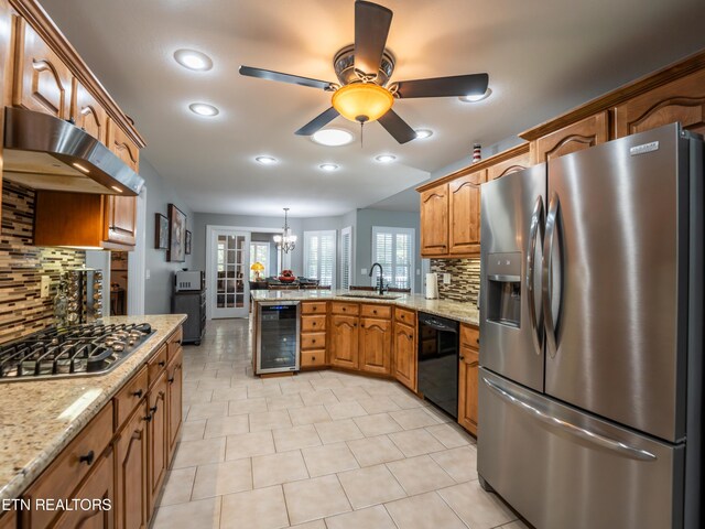 kitchen featuring wine cooler, tasteful backsplash, pendant lighting, stainless steel appliances, and ceiling fan