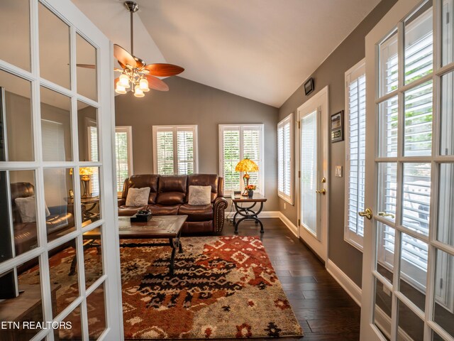 living room featuring french doors, lofted ceiling, dark hardwood / wood-style flooring, and ceiling fan