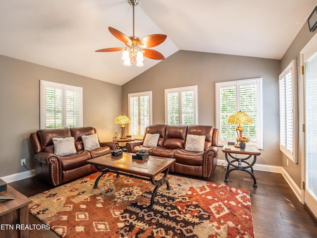 living room with lofted ceiling, ceiling fan, and dark wood-type flooring