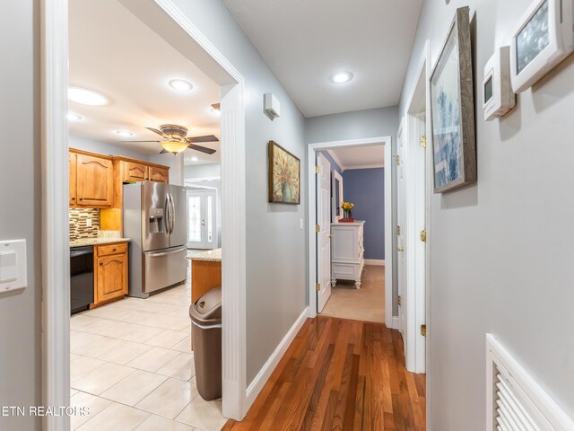 hallway with light hardwood / wood-style flooring