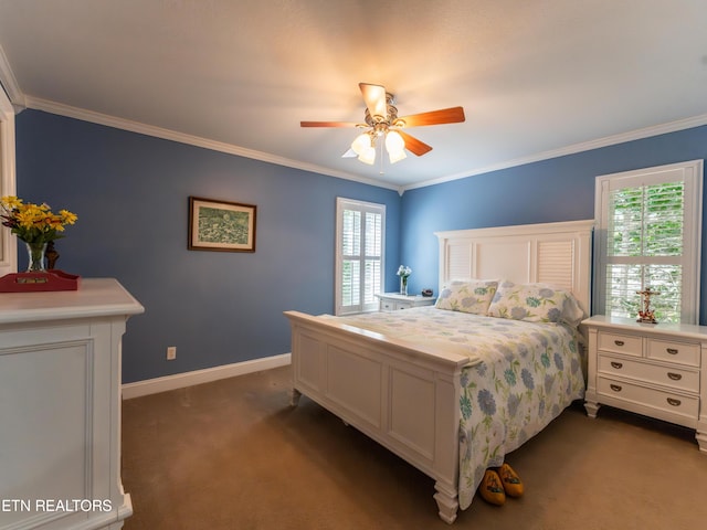 bedroom featuring ornamental molding, dark colored carpet, multiple windows, and ceiling fan