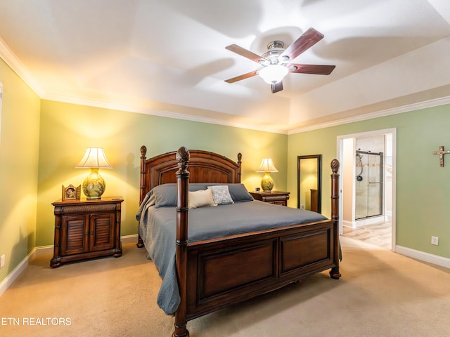 bedroom featuring ceiling fan, light colored carpet, connected bathroom, and ornamental molding