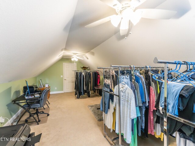 spacious closet with carpet, vaulted ceiling, and ceiling fan