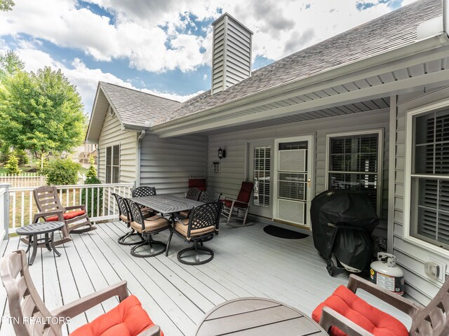 wooden terrace with grilling area