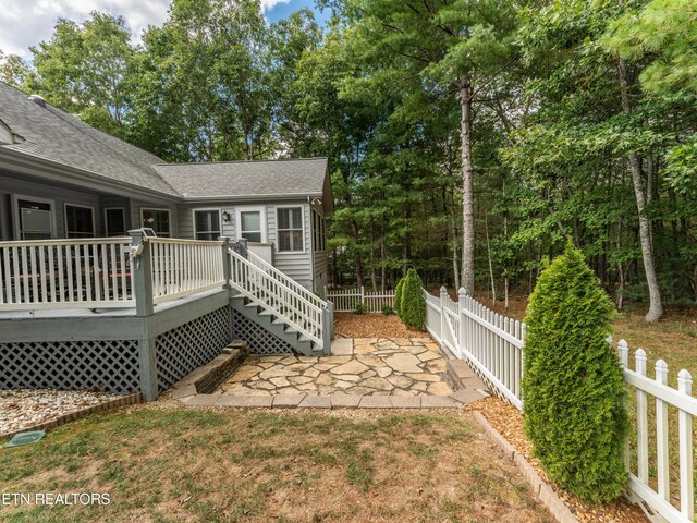 view of yard with a deck and a patio area