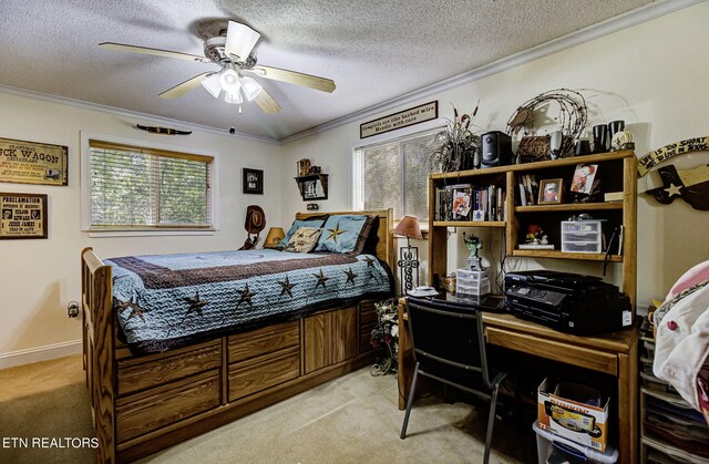 carpeted bedroom with a textured ceiling, ceiling fan, and crown molding