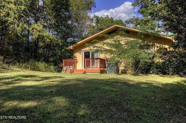 exterior space featuring a wooden deck