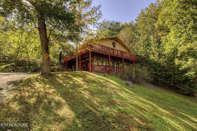 view of yard featuring a wooden deck