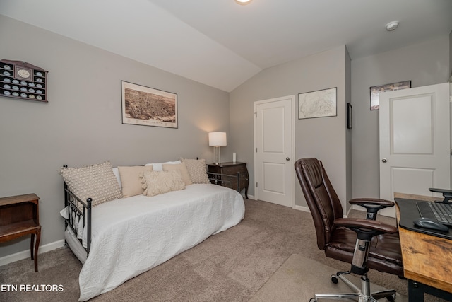 bedroom featuring carpet floors and lofted ceiling