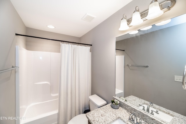 full bathroom featuring shower / bath combination with curtain, vanity, and toilet