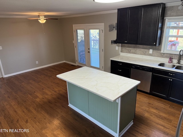 kitchen with sink, decorative backsplash, dark wood-type flooring, and dishwasher