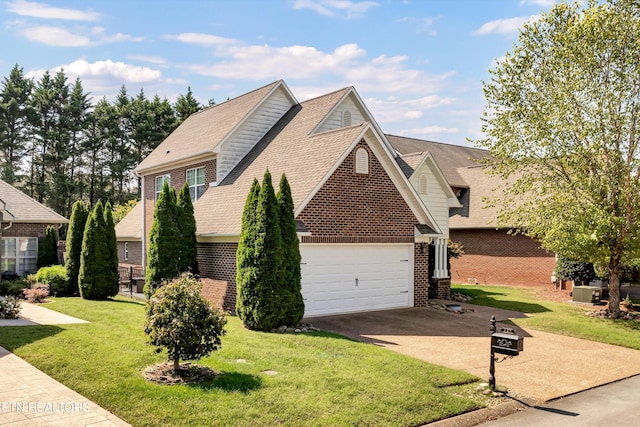 view of front of house with a garage and a front lawn