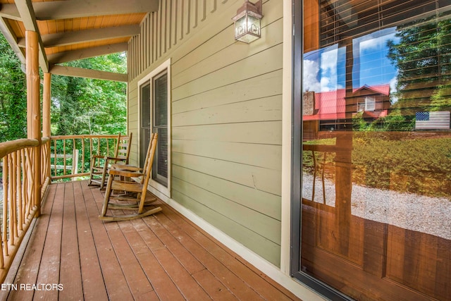 wooden deck featuring a porch