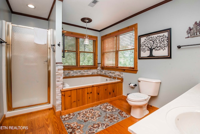 full bathroom featuring shower with separate bathtub, hardwood / wood-style floors, toilet, and sink